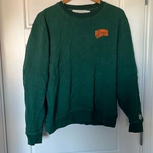 BBC sweatshirt. Embroidered sleeve detail. Emerald green.